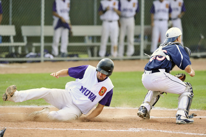 Jamie Ross of Nova Seafood slides across the plate in the third inning Thursday as Bangor catcher Dylan Morris waits for the late throw. Nova Seafood kept rolling with a 12-1 victory.