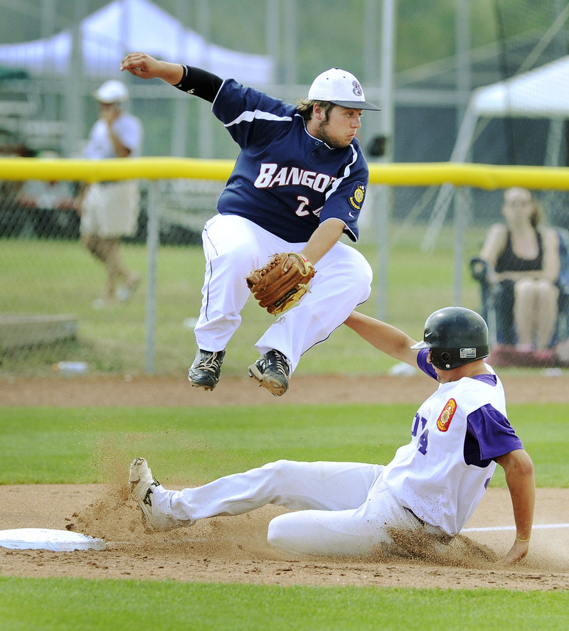 Jamie Ross of Nova Seafood slides safely into third after a passed ball Thursday as Devin Lyshon of Bangor attempts to handle the throw. Nova Seafood won 12-1 in the American Legion state tournament.
