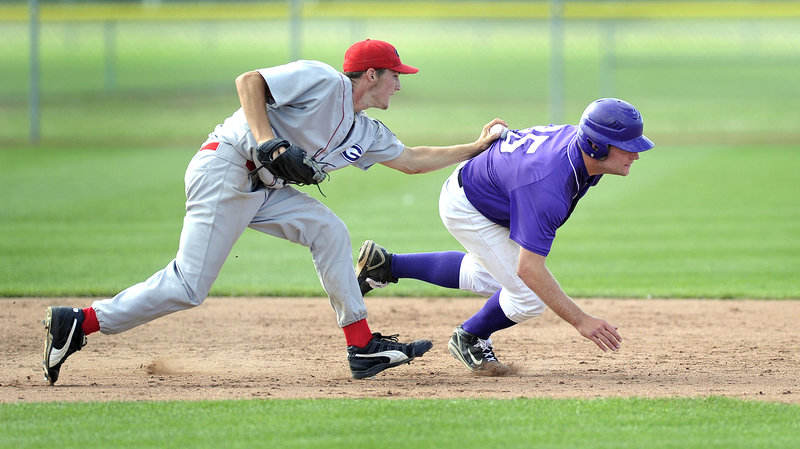 Corbin Hyde, the pitcher for Gayton Post of Lewiston, slaps a tag on Devon Fitzgerald of Nova Seafood during a rundown between second and third base in their American Legion state tournament game Friday at South Portland. Gayton won 8-7 with a three-run ninth inning.