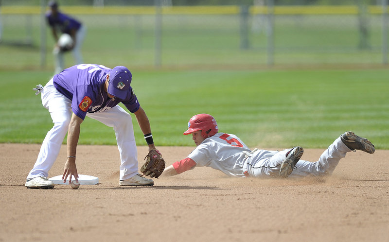 Nick Colucci of Nova Seafood picks up the ball in time to tag out Alex Wong of Gayton Post, who slid past the bag while attempting to steal second. Gayton earned a spot in the championship round with an 8-7 victory.