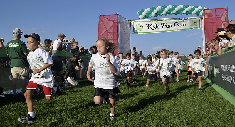 Nick Stinson, 6, left, leads the pack of 5- and 6-year-olds during that age groupÃ¢ÂÂs heat of the TD Bank Beach to Beacon Kids Fun Run at Fort Williams Park in Cape Elizabeth on Friday. Participants had to run around the entire track during the competition.
