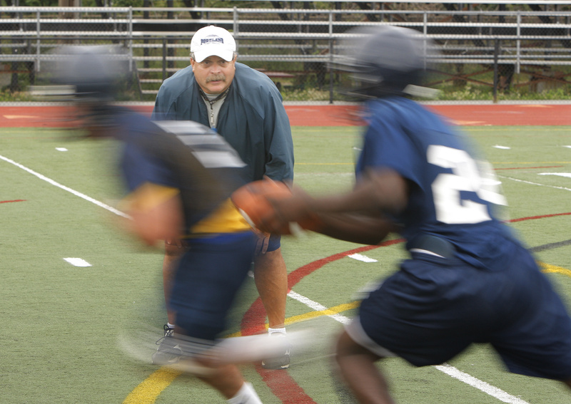 Mike Bailey, Portland High's longtime football coach, watches his players run a play during a practice Monday at Fitzpatrick Stadium.