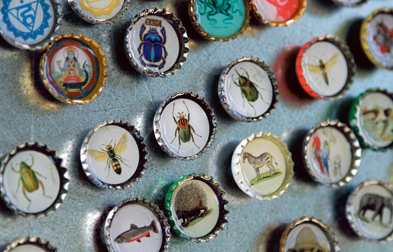 Magnets made with recycled bottle caps are displayed at the booth of Romona & Beatrice during the Picnic Music + Arts festival at Lincoln Park in Portland on Saturday.
