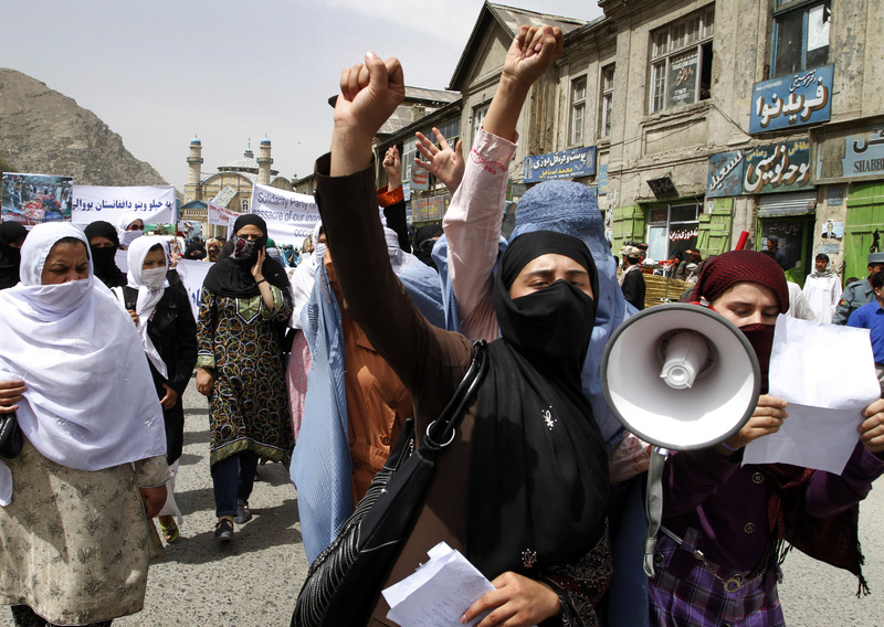 Afghan women chant slogans against NATO and U.S. forces condemning the alleged killing of 52 civilians by NATO and U.S. forces in Afghanistan, during a demonstration in Kabul on Sunday. NATO has repeatedly disputed the allegations of civilian deaths.