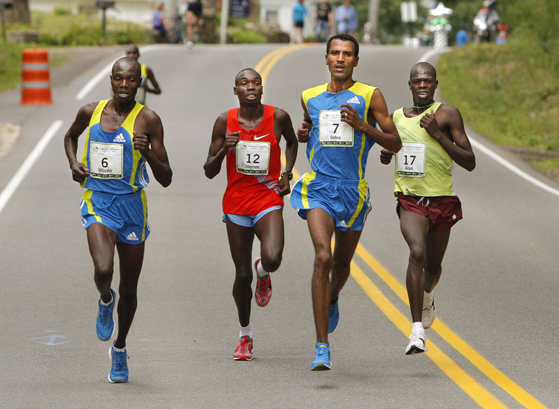 As they near the entrance to Fort Williams Park this morning, Gebre Gebremariam, No. 7, leads a small pack of elite runners including Wilson Chebet (6), Stephen Kipkosgei-Kibet (12) and Alan Kiprono (17). Gebremariam won the TD Bank Beach to Beacon race with a time of 27 minutes, 40 seconds.