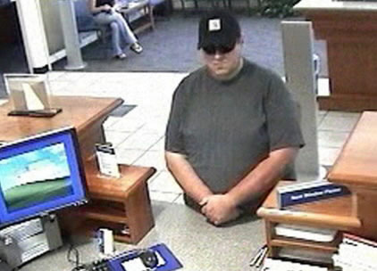 This July 13, 2010 security camera photo released by the Orono police shows Robert Ferguson, of Lowell, Mass., at Bangor Savings Bank in Orono.