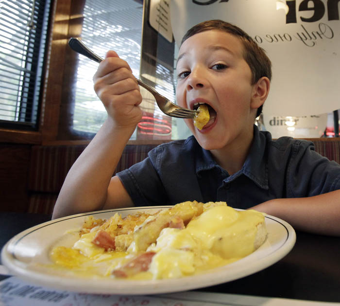 Seven-year-old Dominic Chiodo of Des Moines, Iowa, eats eggs benedict at a diner in Des Moines. Manager Shannon Vilmain said that more customers have been asking about the brand names of the eggs used and whether they're safe. It's right for consumers to be vigilant when it comes to food safety.