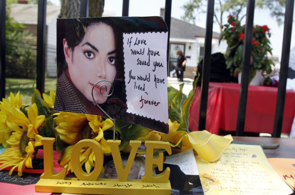 Cards and flowers adorn Michael Jackson’s boyhood home in Gary, Ind. A multimillion-dollar lawsuit against the late singer over a failed reunion concert was dismissed Thursday.