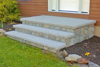 Composite materials that look like wood make durable steps too, but can be pricey. Concrete steps are usually less expensive than cut stone steps, such as those made of granite.