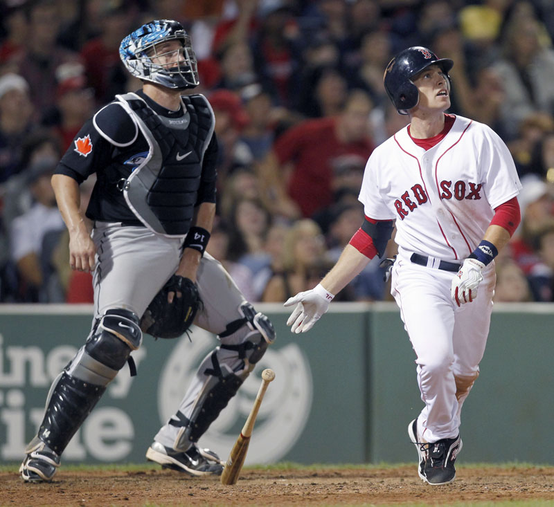 Jed Lowrie homered in the bottom of the 11th inning Saturday night as the Red Sox beat the Toronto Blue Jays 5-4 in Boston.