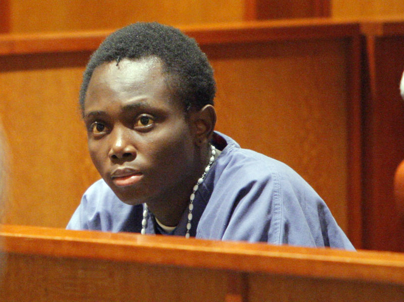 Before his sentencing, Yannick Mulongo, 22, listens as the brother of Guy Kitoko addresses the court.