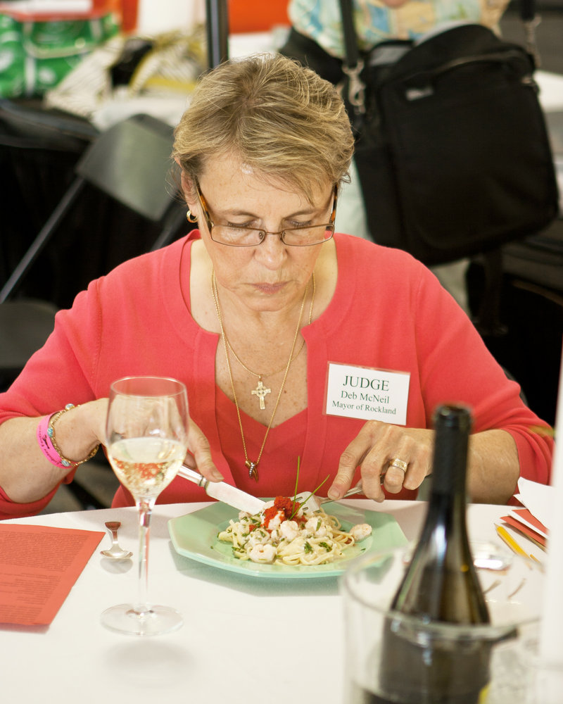 Rockland Mayor Deb McNeil samples a dish at last year’s Seafood Cooking Contest. McNeil will be on the judges’ panel again this year.