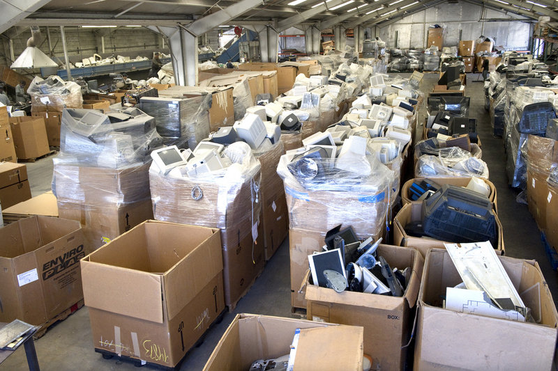 Boxes are filled with computer and television monitors at ECS Refining in Santa Clara, Calif.