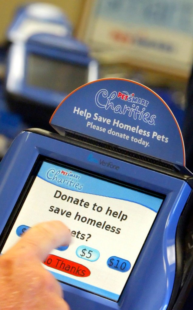 PetSmart, like many retailers, prompts customers for donations to its charities year-round. Here, a customer donates $5 to a program for stray animals.