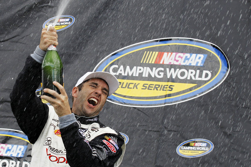 Elliott Sadler celebrates after winning the Camping World Truck Series race Saturday at Pocono Raceway – his first victory at any NASCAR level since 2004.