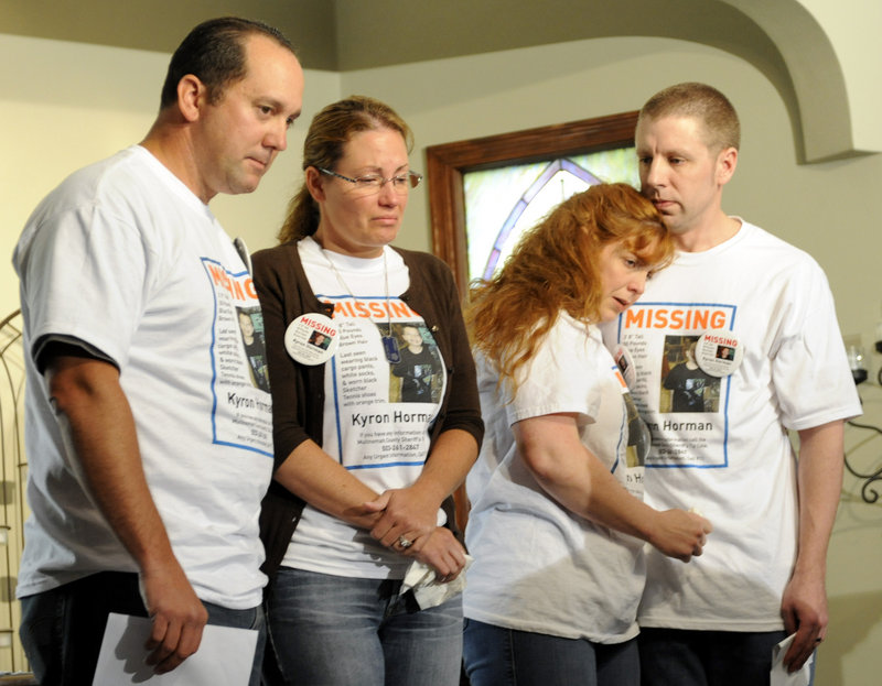 The family of missing 7-year-old Kyron Horman are, from left, Tony Young; the boy’s mother, Desiree Young; Terri Horman, the boy’s stepmother; and the boy’s father, Kaine Horman. They are shown together in June, before several bizarre twists.
