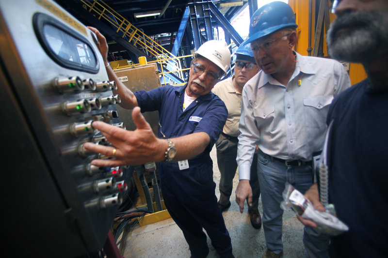 Interior Secretary Ken Salazar, second from right, looks at blowout preventer controls as he tours the Murphy Front Runner deep-water oil drilling rig in the Gulf of Mexico on Wednesday. Second from left is Deputy Interior Secretary David Hayes, and partially visible at right is the director of the Bureau of Ocean Energy Management, Regulation and Enforcement, Michael R. Bromwich.