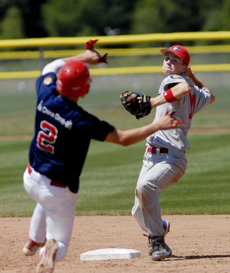 Luke Cote of Gayton Post throws to first base to complete a double play after forcing Augusta's Colin McKee at second.