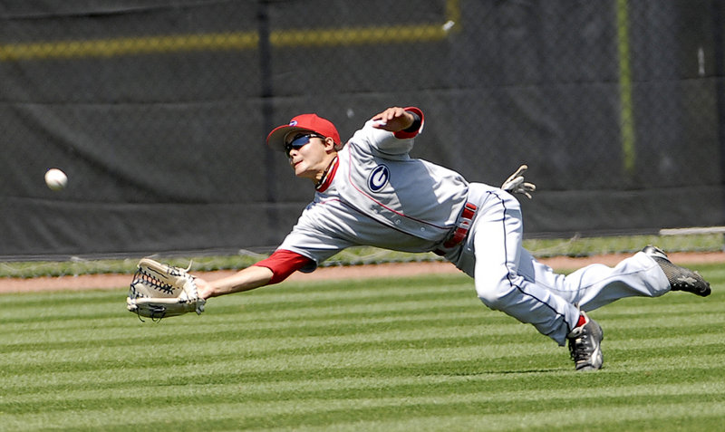 Gayton center fielder Alex Wong, the tournament MVP, dives for a fly ball but can't make the catch Sunday against Augusta in the American Legion baseball state tournament at South Portland.