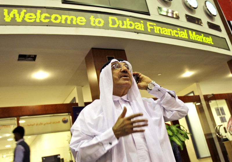 A man using a smartphone at the Dubai Financial Market in Dubai, United Arab Emirates, is a common sight that may change. The UAE said Sunday it will block key features on BlackBerrys because the government can't monitor their use.
