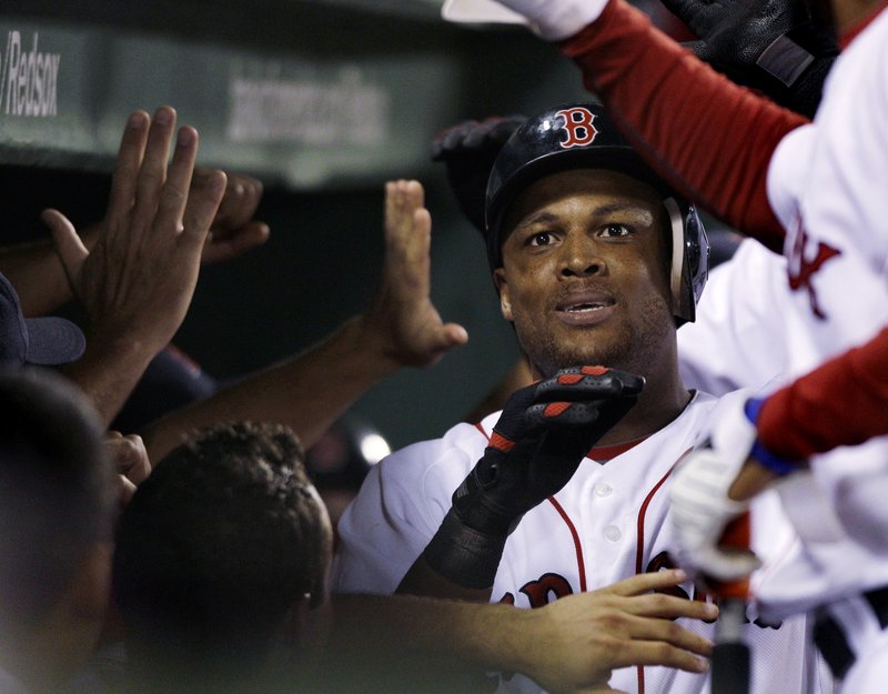 Adrian Beltre is all smiles in the Red Sox dugout after hitting a three-run homer in the eighth inning Monday night. His second homer of the game made it a one-run game, but the Sox ended up losing to the Indians, 6-5.