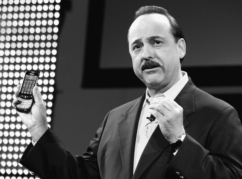 Ralph de la Vega, president of AT&T Mobility and Consumer Markets, holds the new BlackBerry Torch on Tuesday in New York. It is the first BlackBerry with a touch screen and full-alphabet keypad.