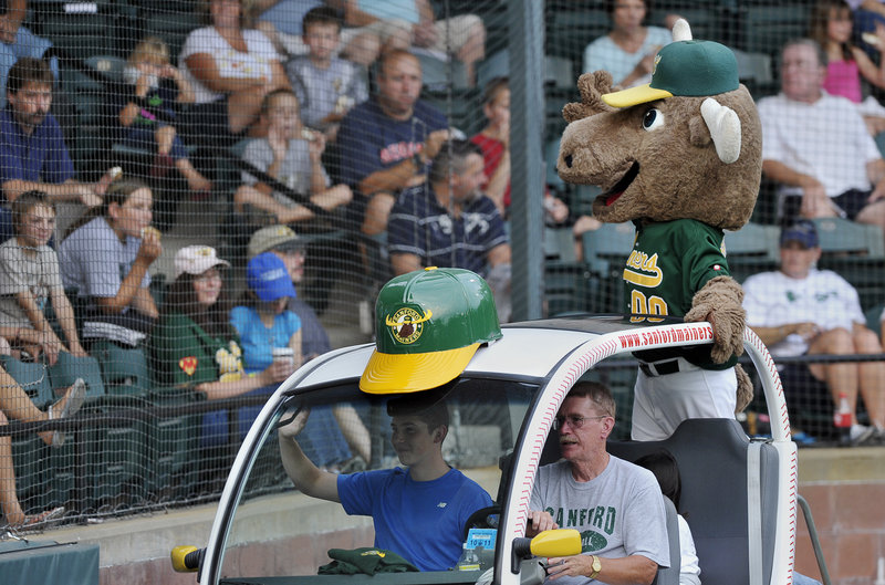Broose the Moose, mascot of the Sanford Mainers, entertains fans between innings of an NECBL playoff game. The Mainers beat the North Shore Navigators to force a deciding game tonight.