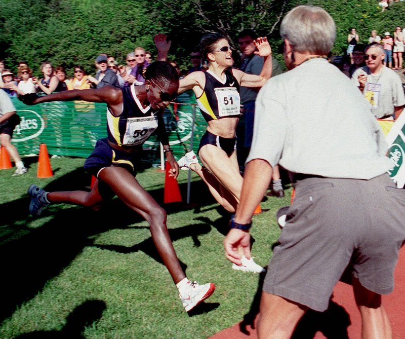Catherine Ndereba surges for the victory in 2000 as Libbie Hickman holds up her hands, thinking the ceremonial finish line was the real finish.