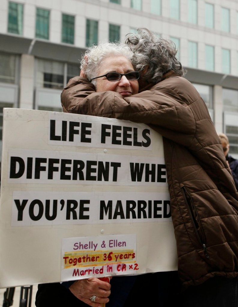 Shelly Bailes, left, hugs her wife, Ellen Pontac, outside the Phillip Burton Federal Building in San Francisco on Wednesday.