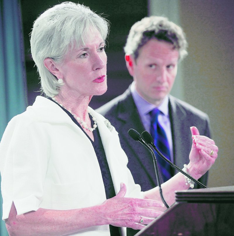 Treasury Secretary Timothy Geithner listens as Health and Human Services Secretary Kathleen Sebelius, a fellow system trustee, talks about the latest Medicare financial projections.