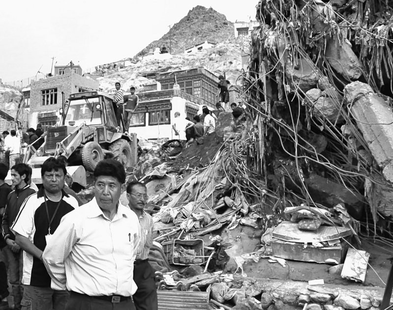 Officials inspect the damage in Leh, in Indian-controlled Kashmir’s mountainous Ladakh region, after Friday’s flooding.