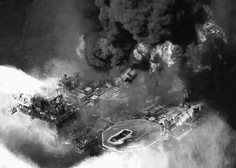 Aerial photo taken April 21 shows the Deepwater Horizon oil rig burning in the Gulf of Mexico more than 50 miles southeast of Venice, La. Authorities are turning their attention to gathering evidence from what resembles a crime scene at the bottom of the sea.