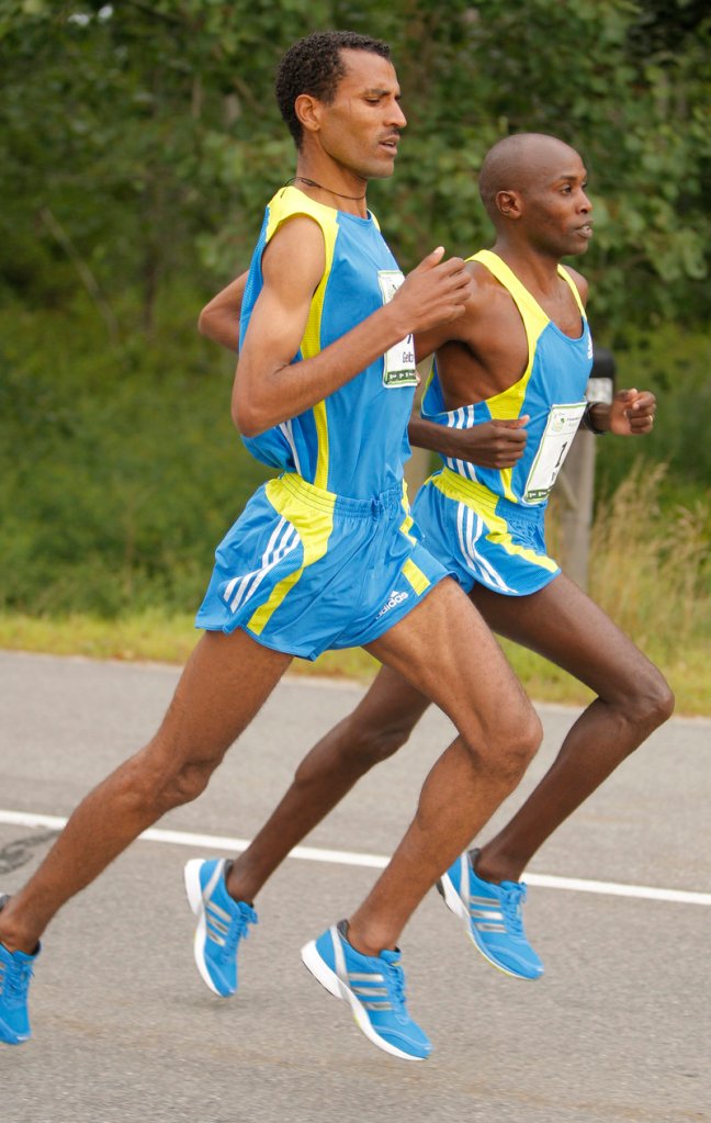 Beach to Beacon winner Gebre Gebremariam, left, runs shoulder to shoulder with two-time defending champ Ed Muge. Muge finished fifth.