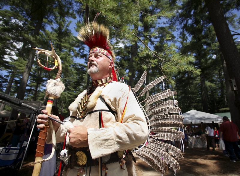 George Castonguay of Jay enters the dance ring during the Grand Entry at the powwow, which continues today.