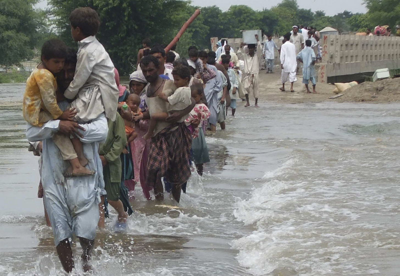 Pakistanis flee their flooded villages in Rajanpur on Sunday. The south Asian country will need billions of dollars to recover from its worst floods in history, further straining a country already dependent on foreign aid to prop up its economy and back its war against Islamist militants, the U.N. said.