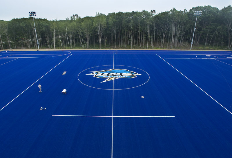 The Nor’easter logo is among the last finishing touches being added last week to the University of New England’s new turf field, a recent addition that will be used principally by the school’s lacrosse and field hockey teams.