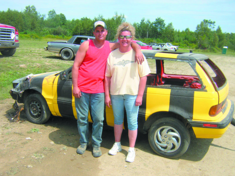 Shane and Sonya Williamson, operators of Boondocks Raceway in Skowhegan, take a break from the shooting of “Bumble Bee Cabs” on Sunday. Parts of the short film, directed by former Skowhegan resident Mo Twine, were shot here.