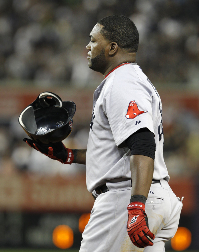 David Ortiz tosses his helmet after grounding out with the bases loaded for the final out in the top of the seventh inning Sunday night at Yankee Stadium. Boston wraps up the four-game series today.