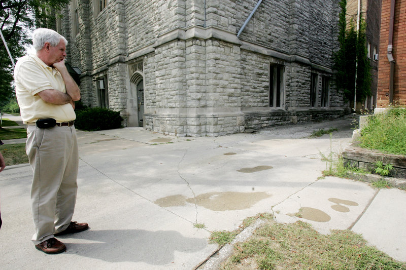 Collingwood Presbyterian Church pastor Robert Anderson stands near the spot in Toledo, Ohio, where church custodian Tony Leno was stabbed Saturday night while giving directions to a motorist.