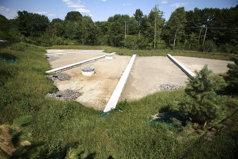 This sand filter behind Dick's Sporting Goods and the IRS office in South Portland allows stormwater to spread before soaking into a layer of soil, sand and mulch and another layer of stone product.