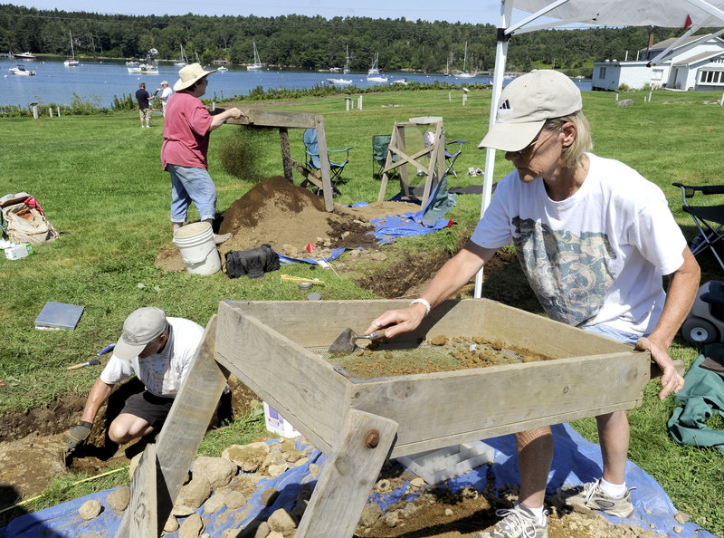 Kaare Mathiasson, from left, Cindy Hook and Carolyn McKeon work a dig site Wednesday at the Pemaquid State Historic site in New Harbor. Archaeologists are searching for the remains of a 17th century British fishing village thought to be buried at the site.