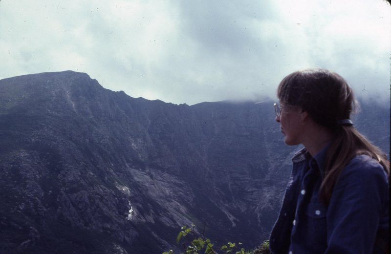 Susan Faust sits at Chimney Pond in Baxter State Park and gazes at the Knife Edge, a hiking trail on Mt. Katahdin, on her second wedding anniversary in July 1982.