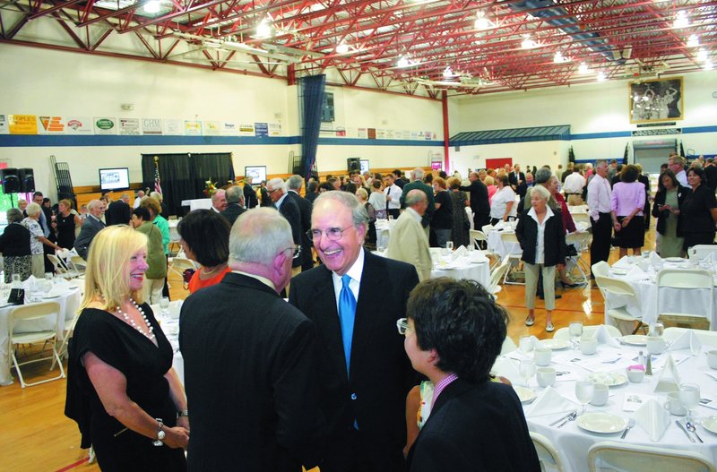 Former Sen. George Mitchell chats with renowned attorney F. Lee Bailey during the tribute to Mitchell at the Alfond Youth Center in Waterville on Thursday. Looking on is Bailey’s companion, Debbie Elliott, and Mitchell’s son Andrew, right.