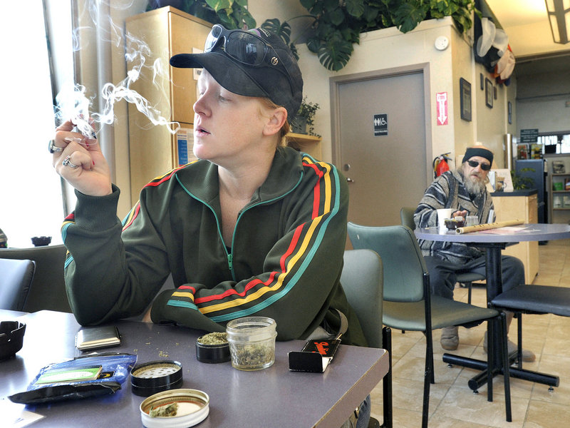 Emily Scarbrough smokes a joint at the Berkeley Patients Group clinic in Berkeley, Calif.
