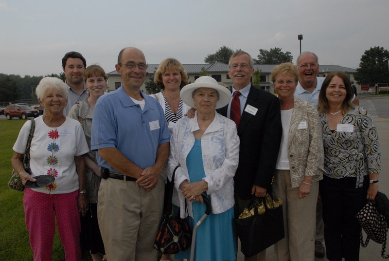 Georgette Nelson, center, with her family, from left, Janet Huot; Patrick and Jessica Ellison; Peter, Jane, Jim and Kathy Nelson; and Ernie and Dianna Huot at the 2009 dedication of the James E. Nelson Hall at Thornton Academy in Saco.