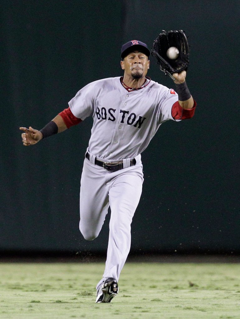 Red Sox center fielder Eric Patterson runs down a fly ball hit by Michael Young of the Rangers during Boston’s 3-1 win Saturday night.