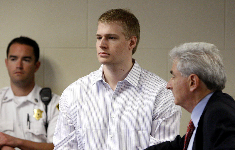 In this June 2009 photo, former Boston University medical student Philip Markoff, center, stands with his attorney John Salsberg, right, during his arraignment in Boston. Markoff was found dead of apparent suicide Sunday.