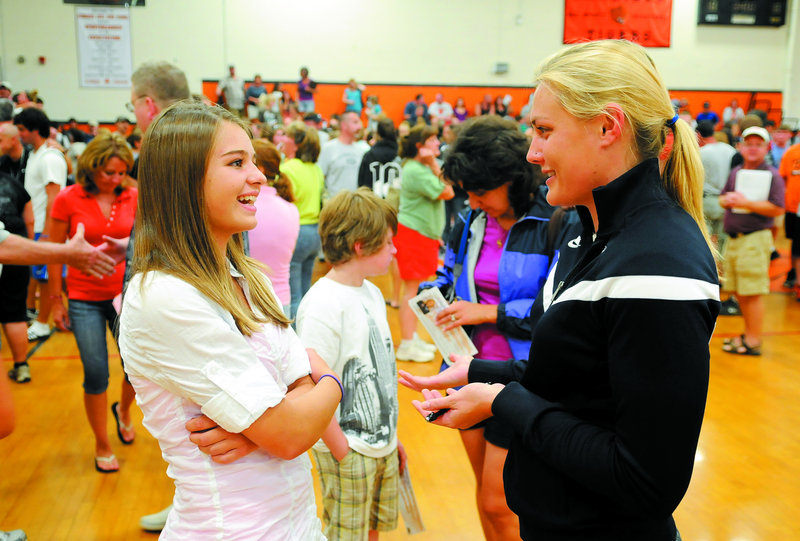 Olympian and Augusta resident Julia Clukey, right, talks with sophomore Tinsley DeForest Sunday at Gardiner Area High School.