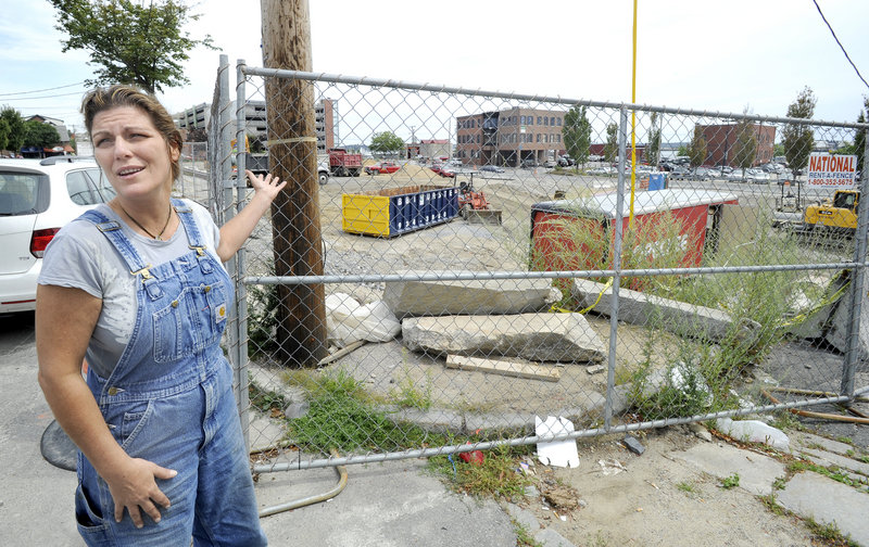 Nancy Pugh, co-owner of Hugo’s restaurant on Middle Street, is unhappy that a two-story parking garage will be built on the former Jordan’s Meats site near her business.