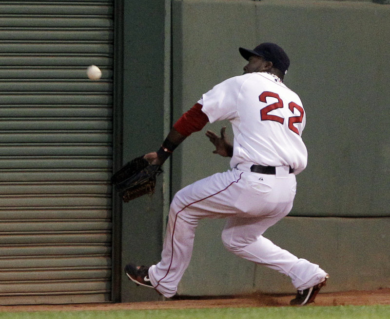 Red Sox left fielder Bill Hall pulls up near the wall and loses the fly ball hit by Maicier Izturis of the Angels in the second inning. Izturis ended up with a double. Hall homered in Boston’s 7-5 victory Wednesday night at Fenway Park.